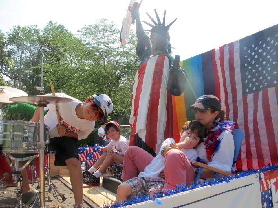 From left, Levi Goldberg, Yonaton Garfinkel, Nate Goldberg and Betsy Nathan won a prize for their float at the Fourth of July parade in Highland Park, Ill., in 2013.