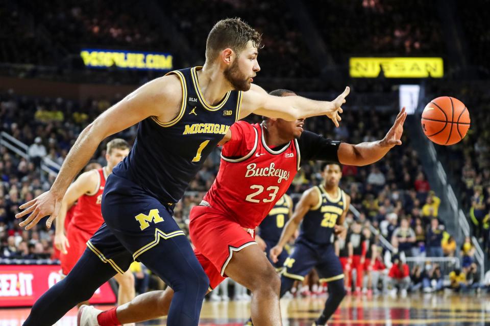 Michigan center Hunter Dickinson (1) and Ohio State forward Zed Key (23) battle for a rebound during the second half at Crisler Center in Ann Arbor on Sunday, Feb. 5, 2023.