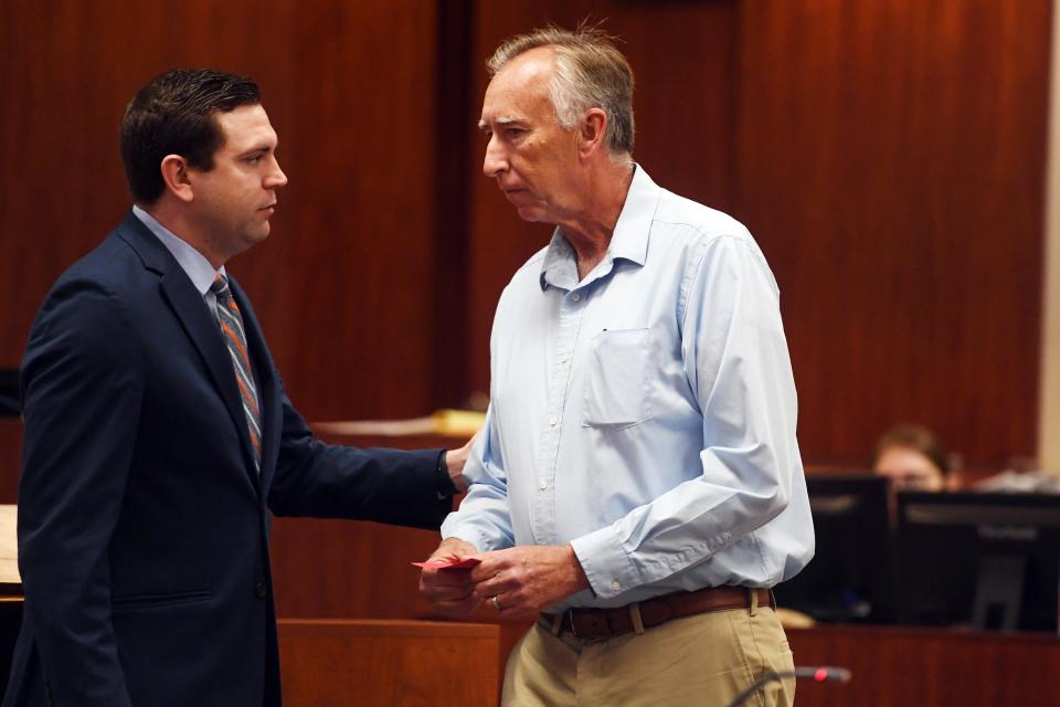 Former Indian River County Assistant Fire Chief Brian Burkeen (right) speaks with his attorney Justin Barenborg on Wednesday, Jan. 8, 2020, after appearing before Circuit Judge Dan Vaughn for a competency hearing at the Indian River County Courthouse. Burkeen, accused of buying more than $300,000 worth of tires using taxpayer money and reselling them, was found competent to stand trial.