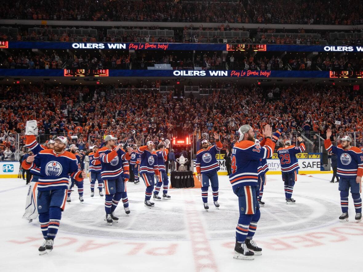 The Edmonton Oilers celebrate their 2-1 win over the Dallas Stars in Game 6 of the Western Conference finals of the NHL Stanley Cup playoffs in Edmonton on Sunday. (Jason Franson/The Canadian Press - image credit)