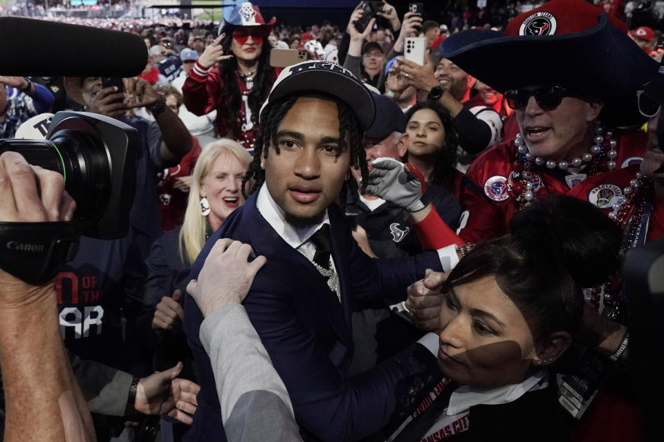 Ohio State quarterback C.J. Stroud meets with fans after being chosen by the Houston Texans with the second overall pick during the first round of the NFL football draft, Thursday, April 27, 2023, in Kansas City, Mo. (AP Photo/Charlie Riedel)