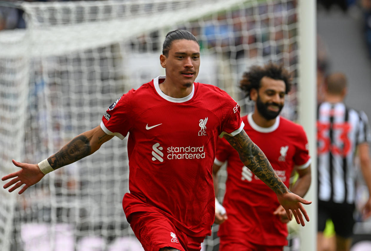 Liverpool forward Darwin Nunez (front) celebrates equalising against Newcastle during their English Premier League clash, while teammate Mohamed Salah looks on.