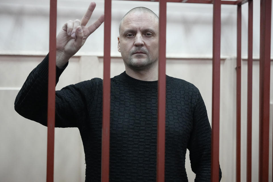 Sergei Udaltsov, Russian left-wing political activist stands in a cage in a courtroom in Moscow, Russia, Friday, Jan. 12, 2024. Sergei Udaltsov, a Russian pro-war activist and critic of President Vladimir Putin, was remanded into custody Thursday over alleged terrorism offenses, his lawyer told the Russian state news agency Tass. (AP Photo/Alexander Zemlianichenko)