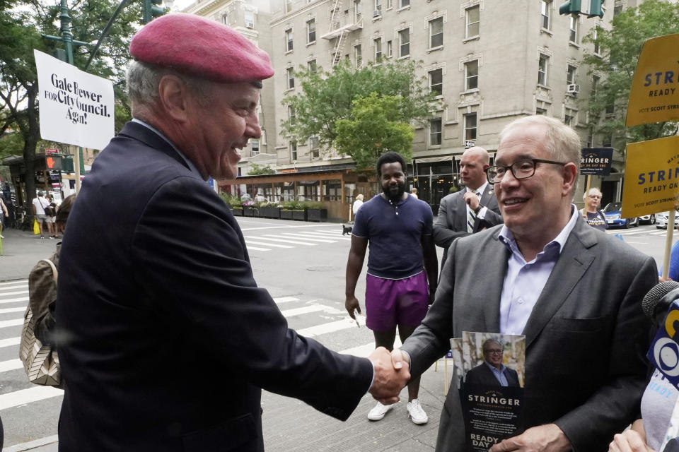 Republican candidate for New York mayor Curtis Sliwa, left, shakes hands with Democrat mayoral candidate Scott Stringer, in New York, Tuesday, June 22, 2021. The final votes are set to be cast Tuesday in New York's party primaries, where mayors, prosecutors, judges and city and county legislators will be on the ballot, along with other municipal offices. (AP Photo/Richard Drew)