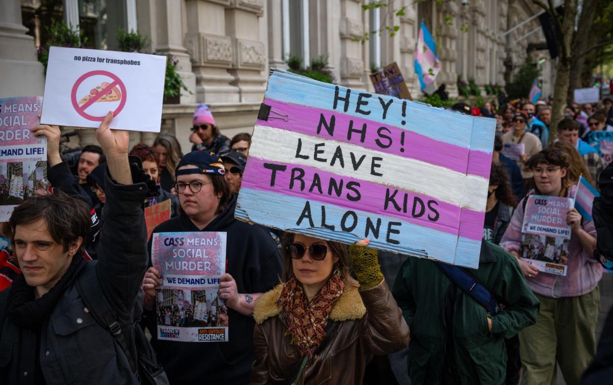 Trans rights activists take part in a protest against the ban on hormone blockers