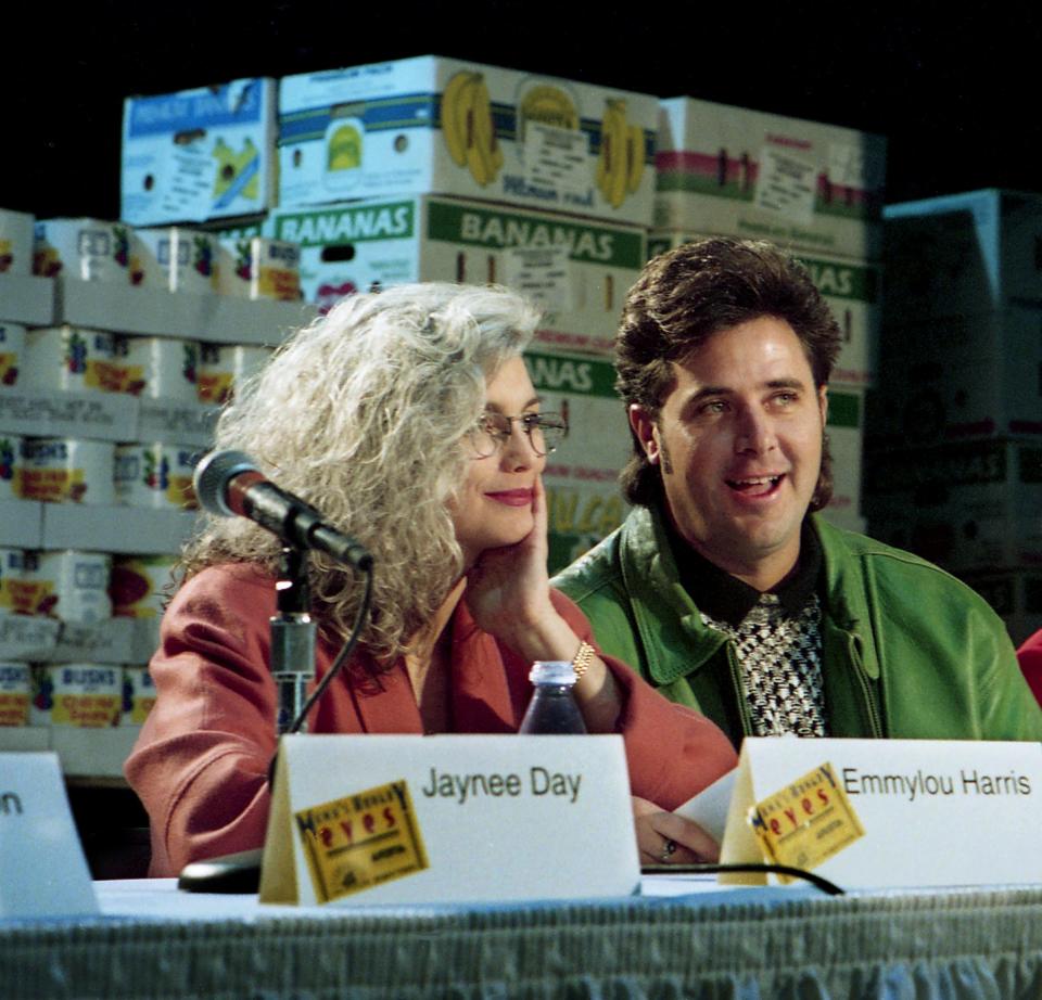 Emmylou Harris, left, and Vince Gill joined forces with music executives and the Second Harvest National Food Bank during a press conference in Nashville on Nov. 22, 1993, to announce a forthcoming Merle Haggard tribute album, “Mama’s Hungry Eyes,” to benefit America’s hungry.