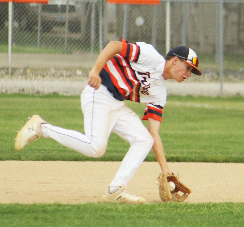 Pontiac second baseman Cayden Masching scoops up a grounder during Thursday's baseball game with Ottawa at The Ballpark at Williamson Field. PTHS won 11-0.