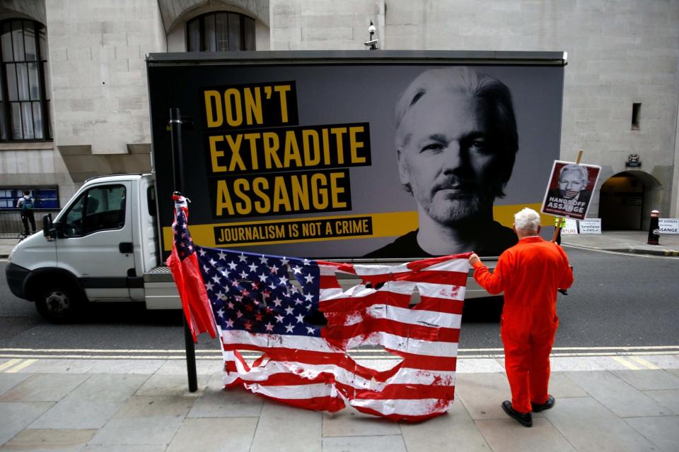 A supporter of WikiLeaks founder Julian Assange protests outside the Old Bailey (REUTERS)