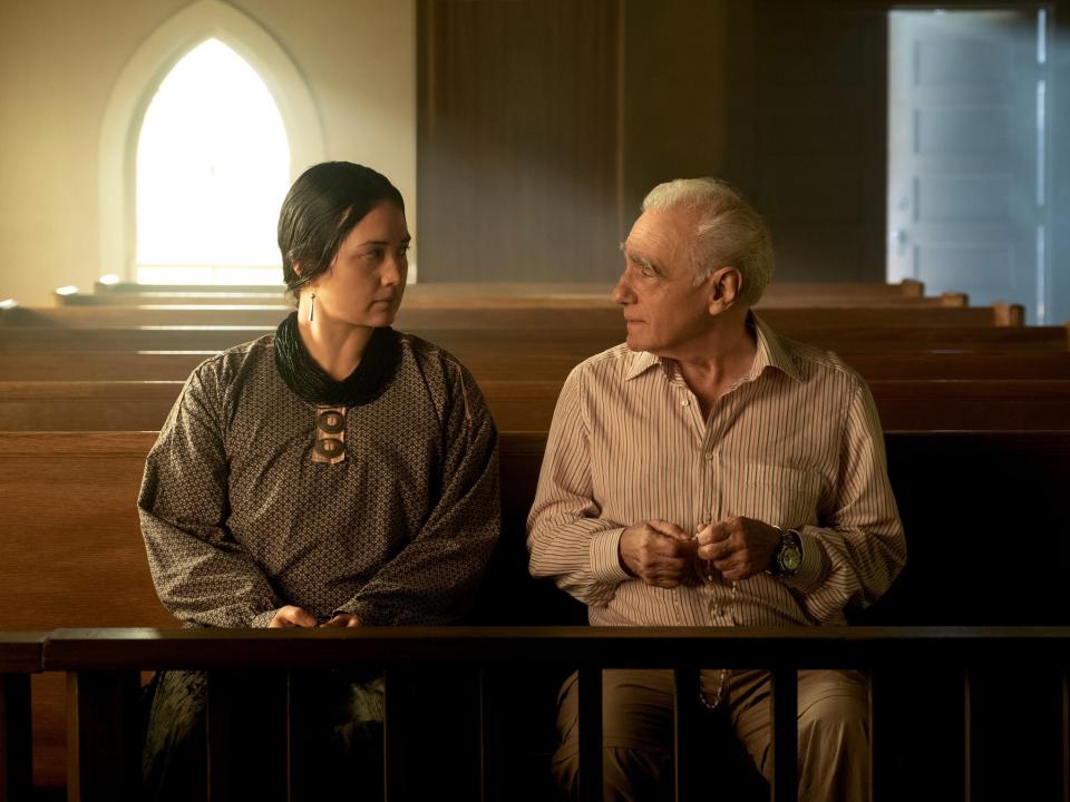 Lily Gladstone and Martin Scorsese sitting on set