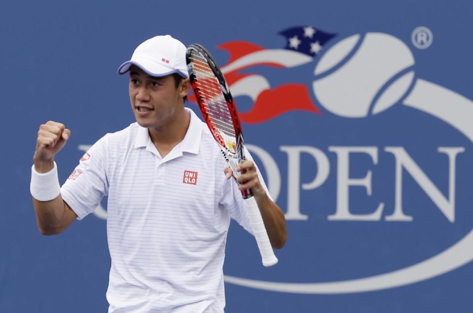 Kei Nishikori, of Japan, reacts after defeating Leonardo Mayer, of Argentina, during the third round. (AP Photo/Seth Wenig)