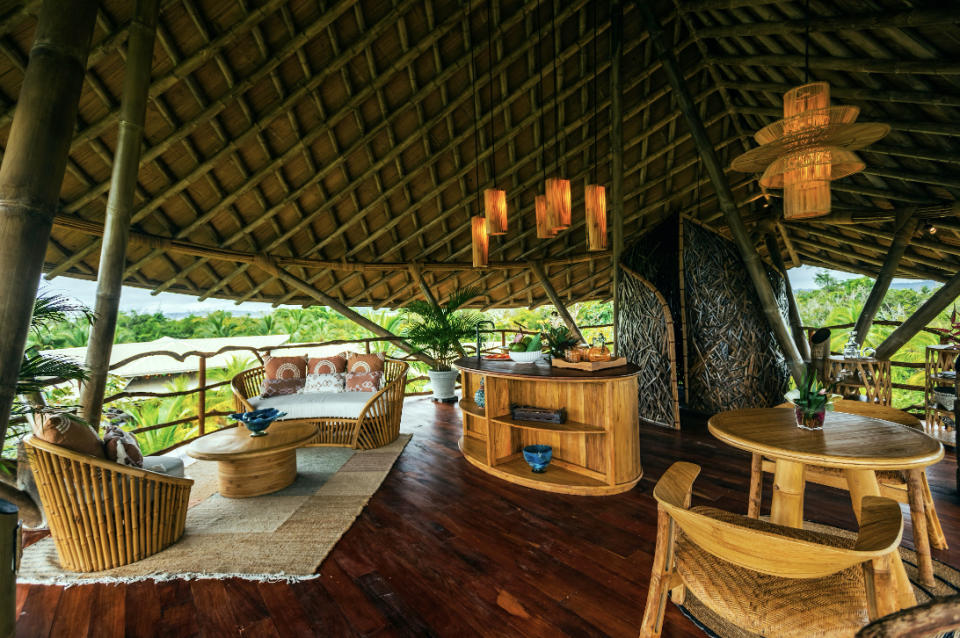 Tables and chairs inside the tree house at Nayara Bocas Del Toro in Panama