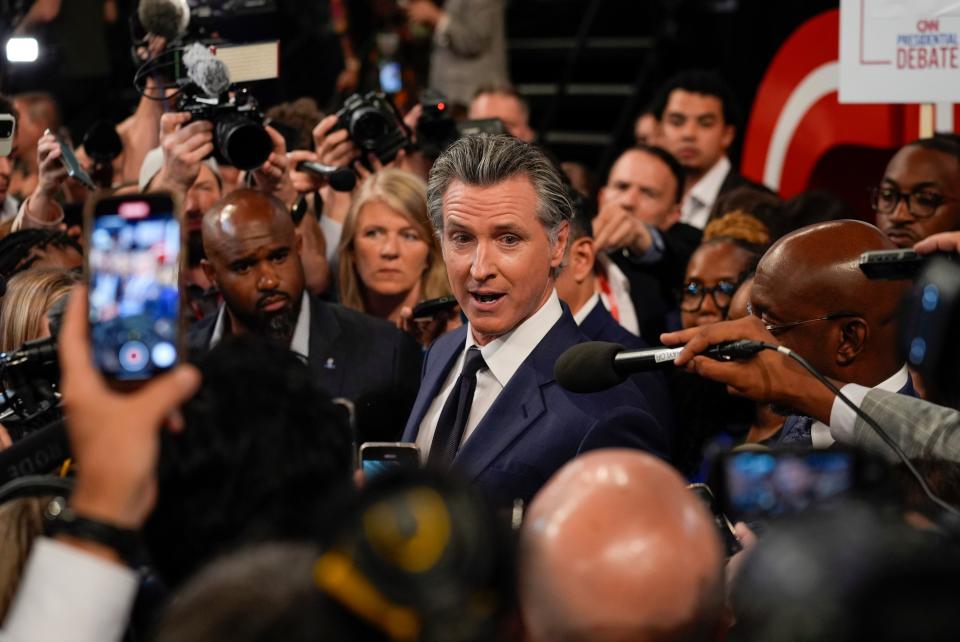 California Governor Gavin Newsom speaks to reporters in the spin room after a presidential debate between President Joe Biden and Republican presidential candidate former President Donald Trump in Atlanta (AP)