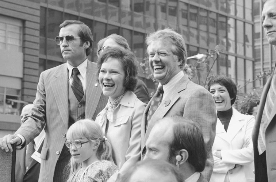 FILE – In this July 10, 1976, file photo Jimmy Carter, his wife Rosalynn and daughter Amy, lower left, respond to a huge crowd that welcomed them to New York. Jimmy and Rosalynn are celebrating their 77th wedding anniversary, Friday, July 7, 2023. (AP Photo, File)
