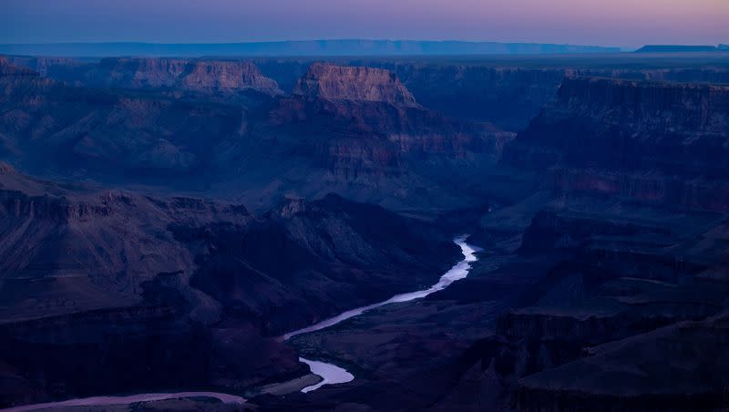 The Colorado River flows through the Grand Canyon at sunrise as seen from the south rim in Grand Canyon National Park in Arizona on Tuesday, Oct. 11, 2022.