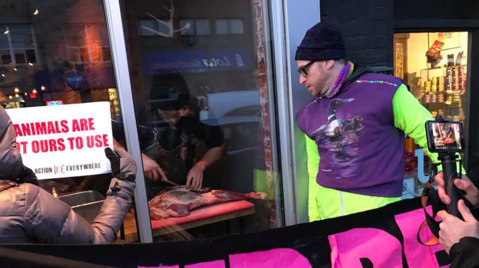 The activists said chef Michael Hunter was taunting them when he started slicing a deer leg on the windowsill. Source: Facebook/Marni Jill Ugar