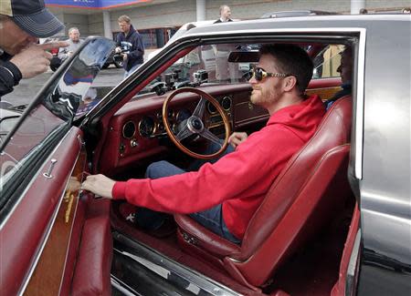 U.S. stock car racing driver Dale Earnhardt Jr. sits in Elvis Presley's 1973 Stutz Blackhawk III during a media event at Charlotte Motor Speedway (CMS) in Charlotte, North Carolina April 1, 2014, in this handout courtesy of CMS. REUTERS/CMS/HHP/Handout via Reuters