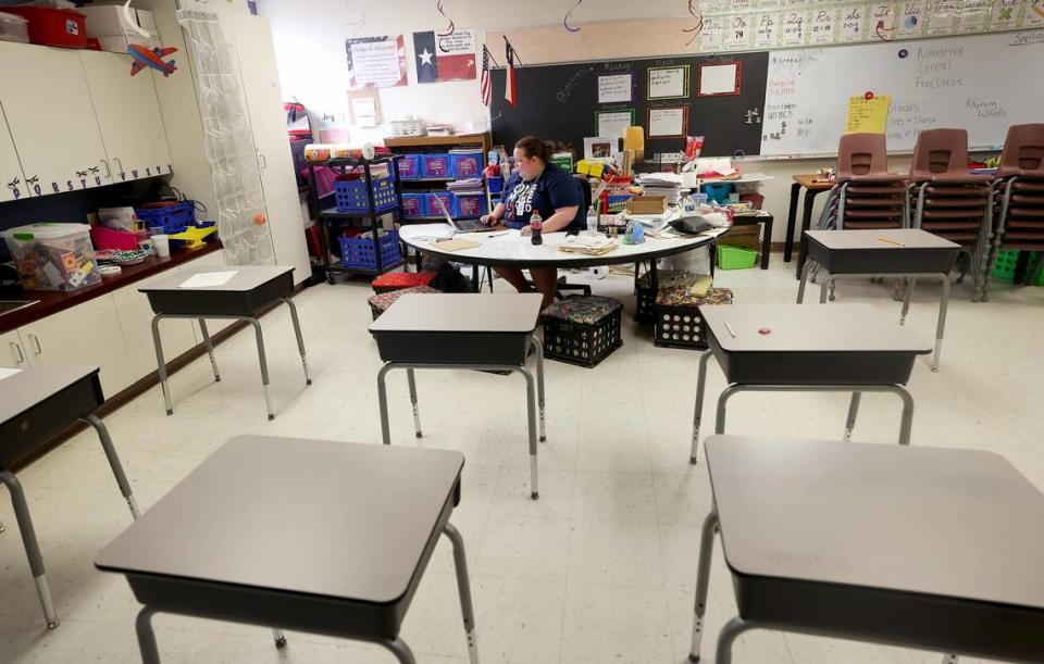 Third-grade teacher Lacy Pruitt catches up on work on Friday, April 14, 2023, at Houston Elementary in Mineral Wells. Mineral Wells ISD is one of the dozens of districts that shifted to a four-day school week.