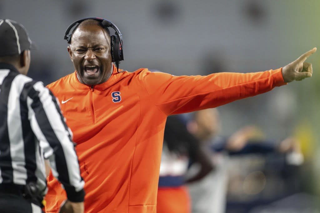Syracuse coach Dino Babers yells to an official during the second half of the team’s NCAA college football game against Georgia Tech, Saturday, Nov. 18, 2023, in Atlanta. (AP Photo/Hakim Wright Sr.)
