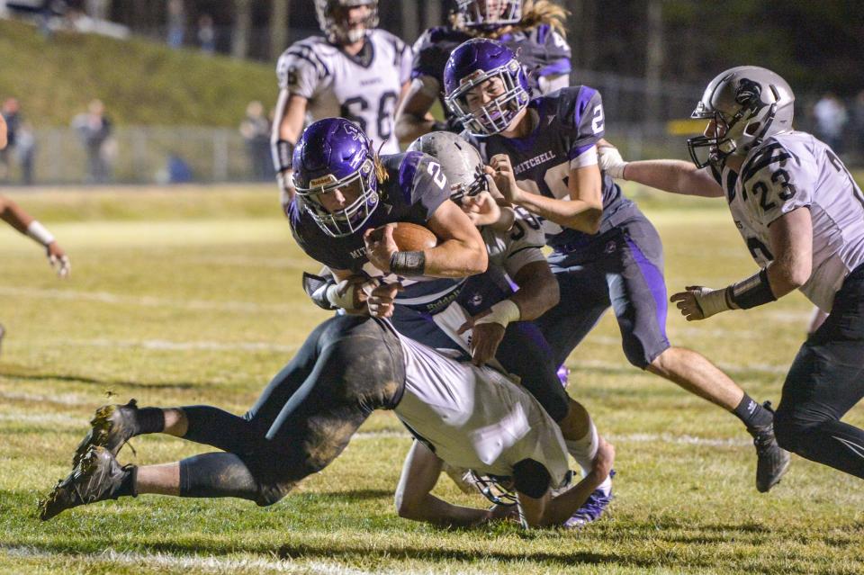 Mitchell's Ty Turbyfill (2) runs the ball during their game against Robbinsville on December 3, 2021. Mitchell defeated Robbinsville 34-21 to become the 2021 regional champions.