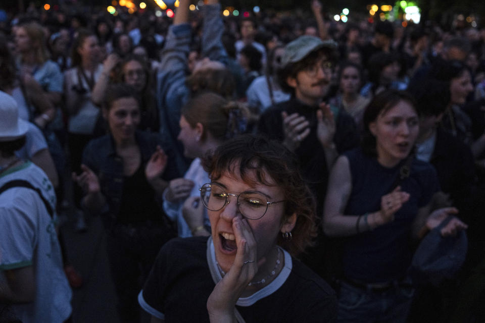 People gather at Republique Square to protest the far-right National Rally, which came out strongly ahead in first-round legislative elections, in Paris, Sunday, June 30, 2024. (AP Photo/Louise Delmotte)