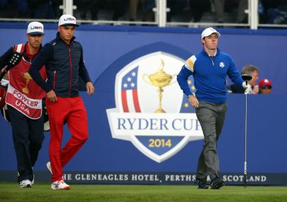 Europe&#39;s Rory McIlroy, right, and Rickie Fowler of the US prepare to play off the fire tee during the singles match on the final day of the Ryder Cup golf tournament at Gleneagles, Scotland, Sunday, Sept. 28, 2014. (AP Photo/Scott Heppell)