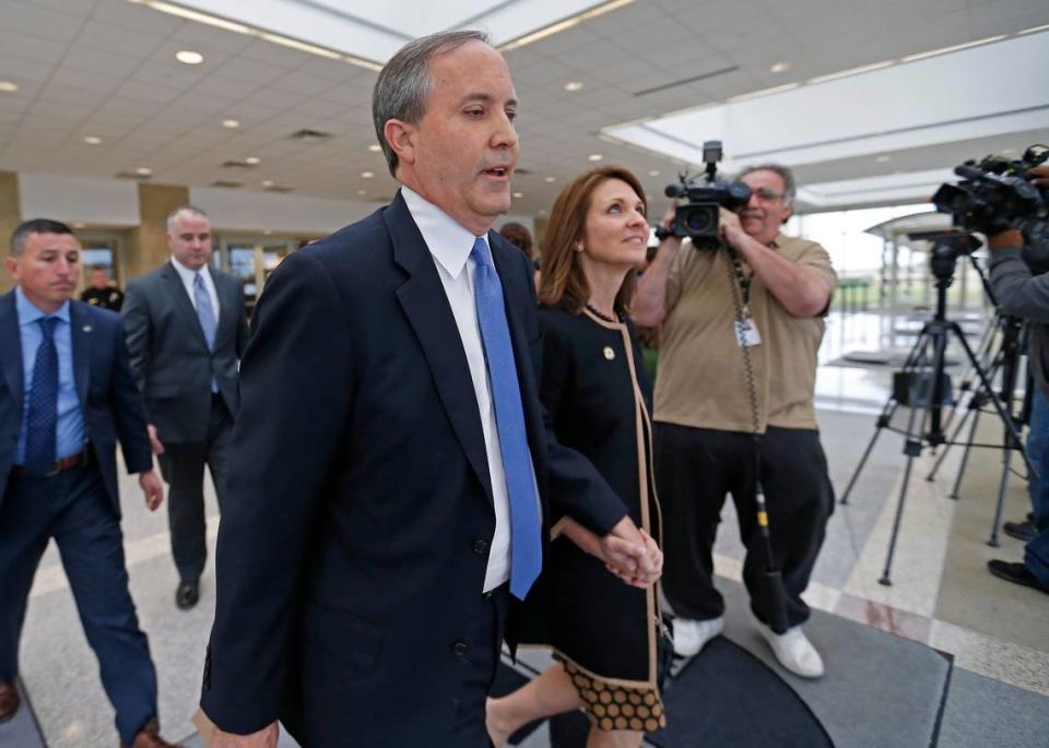 Texas Attorney General Ken Paxton, left, and his wife Angela leave the Collin County courthouse after his pre-trial motion hearing on Tuesday, Dec. 1, 2015, in McKinney, Texas.