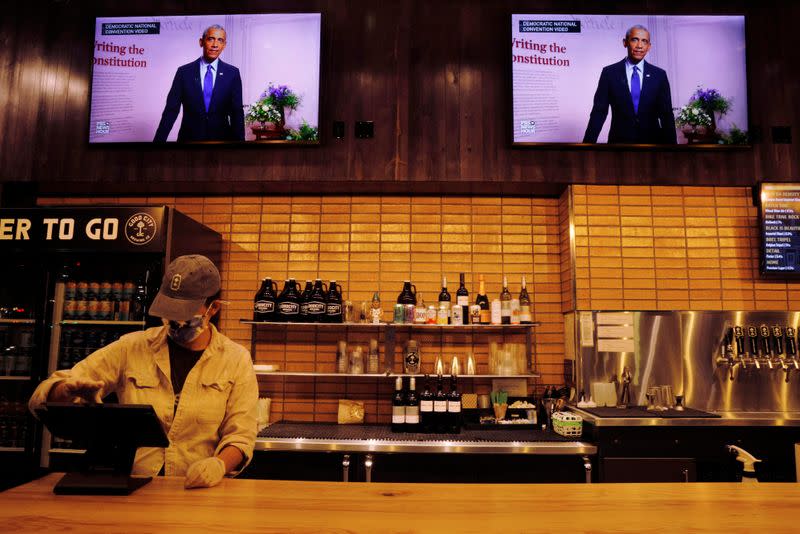 Televisions at Good City Brewing show the Democratic National Convention in Milwaukee