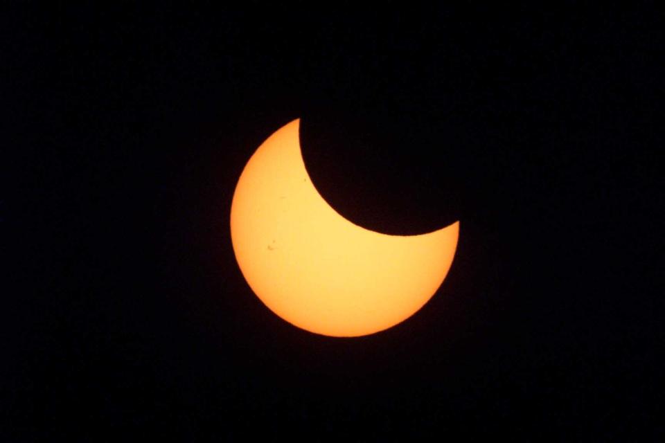 A partial eclipse of the sun appeared in the sky over New York on Christmas Day 2000.