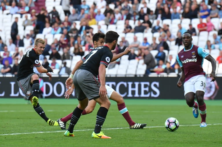 Southampton's English midfielder James Ward-Prowse (L) scores their third goal during the English Premier League football match between West Ham United and Southampton on September 25, 2016