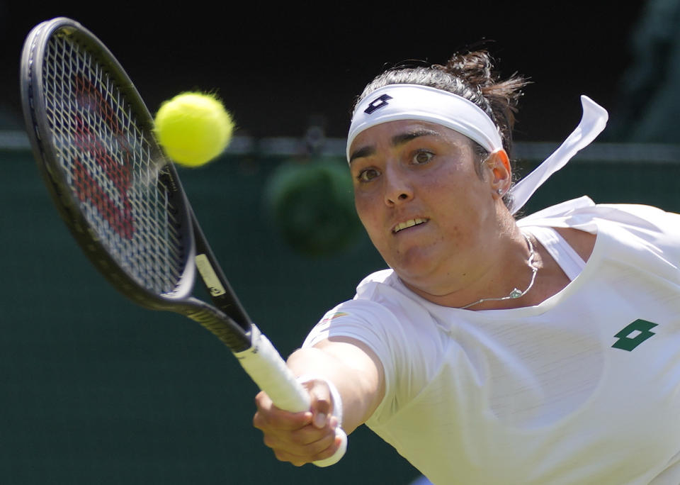 FILE - Tunisia's Ons Jabeur plays a return to Spain's Garbine Muguruza during the women's singles third round match on day five of the Wimbledon Tennis Championships in London, Friday July 2, 2021. Jabeur will compete in the 2022 U.S. Open tennis tournament that begins Monday. (AP Photo/Kirsty Wigglesworth, File)