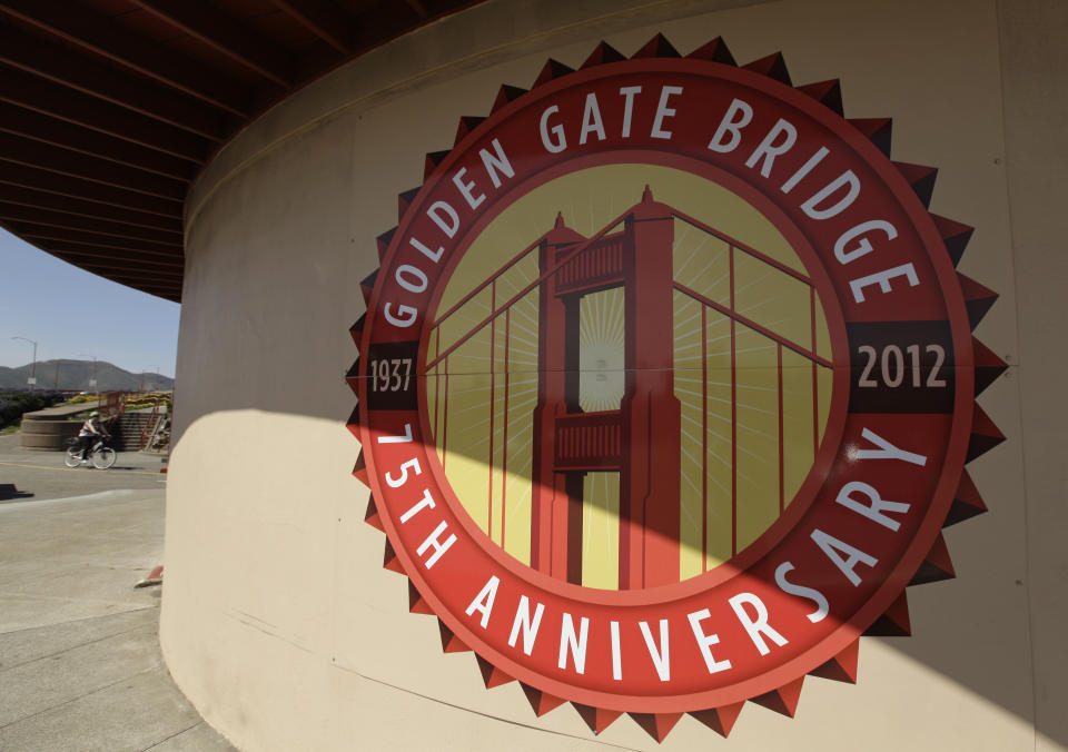 In this photo taken Wednesday, April, 18, 2012, a logo marking the 75h annivsary is painted on the restored Round House at the Golden Gate Bridge in San Francisco. It served as a picturesque backdrop for Jimmy Stewart and Kim Novak’s tensely romantic first meeting in “Vertigo” in 1958, made the cover of Rolling Stone in the ‘70s and was nearly decimated by a falling Romulan drill-of-death in 2009’s “Star Trek.” One way or another, the Golden Gate Bridge has packed a lot of history into its 75-year span. (AP Photo/Eric Risberg)