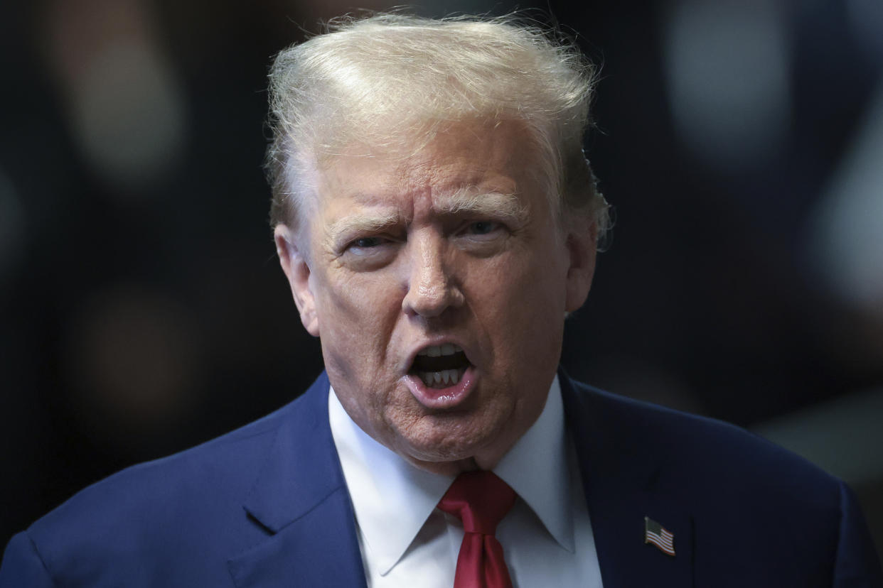 Former President Donald Trump speaks to reporters at Manhattan criminal court on Monday in New York. 