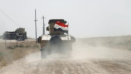 A military vehicle of the Iraqi army is seen in Falluja, Iraq, June 17, 2016. REUTERS/Thaier Al-Sudani