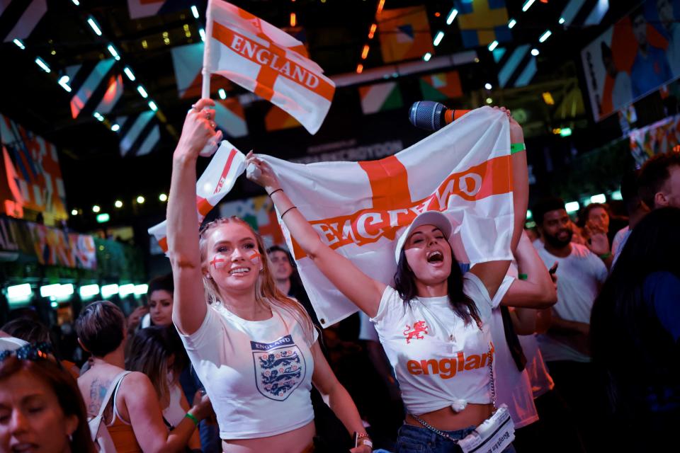 Fans wave flags and show their colours during the tense semi-final clash. 