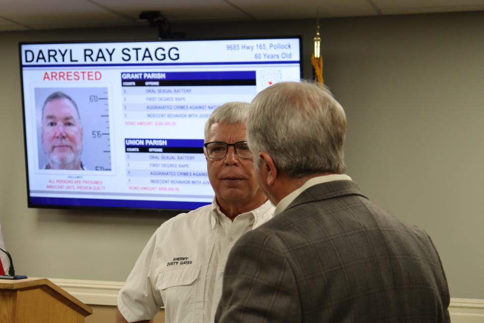Sheriffs Dusty Gates (left) and Mark Wood talk after a press conference Monday in Colfax. The two men, along with Grant Sheriff Steven McCain, urged people who might be victims of Daryl Ray Stagg to come forward.