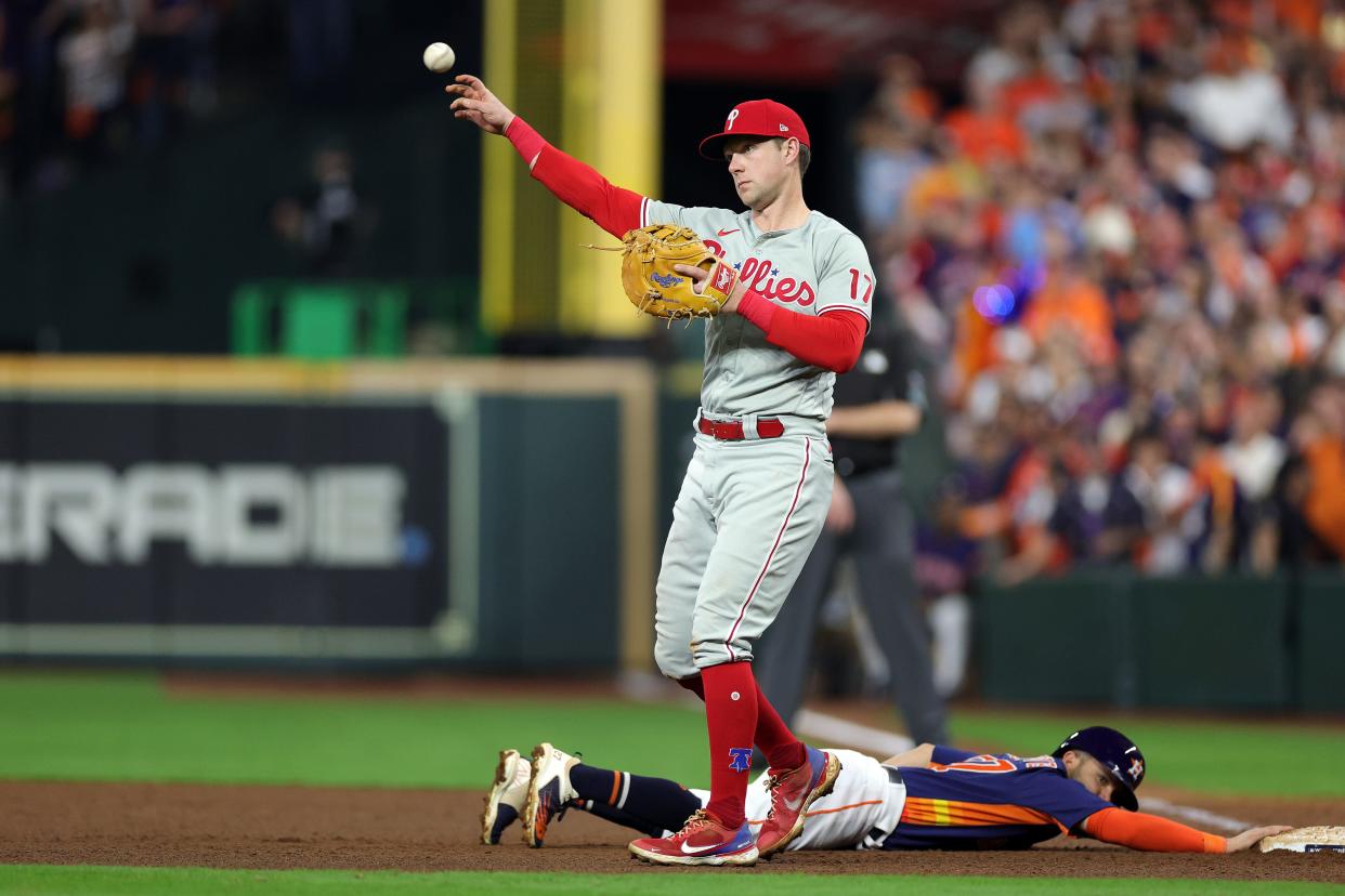 First baseman Rhys Hoskins of the Philadelphia Phillies reacts to Jose Altuve of the Houston Astros being safe during Game 6 of the 2022 World Series at Minute Maid Park in 2022 in Houston, Texas.