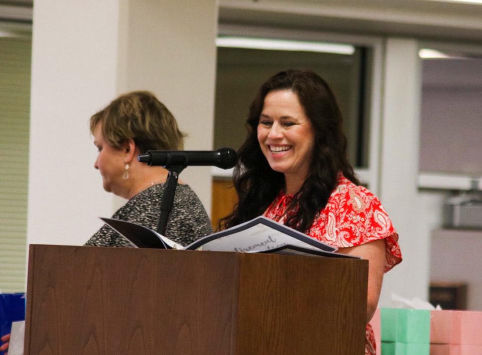 Shanna Rector, deputy superintendent of USD 305, smiles as district retirees are honored May 7.