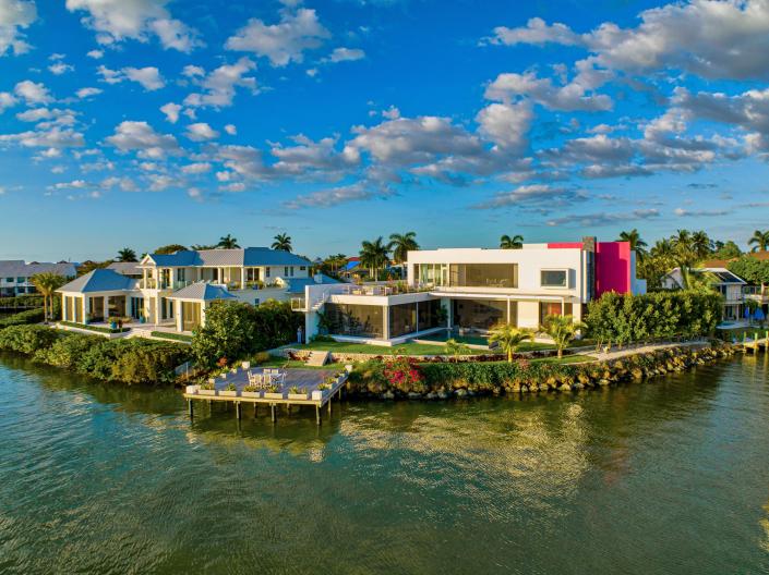 The home known as the Pink House sits on a peninsula along Naples Bay. The pink color is a tribute to the small original house that once sat on the property.