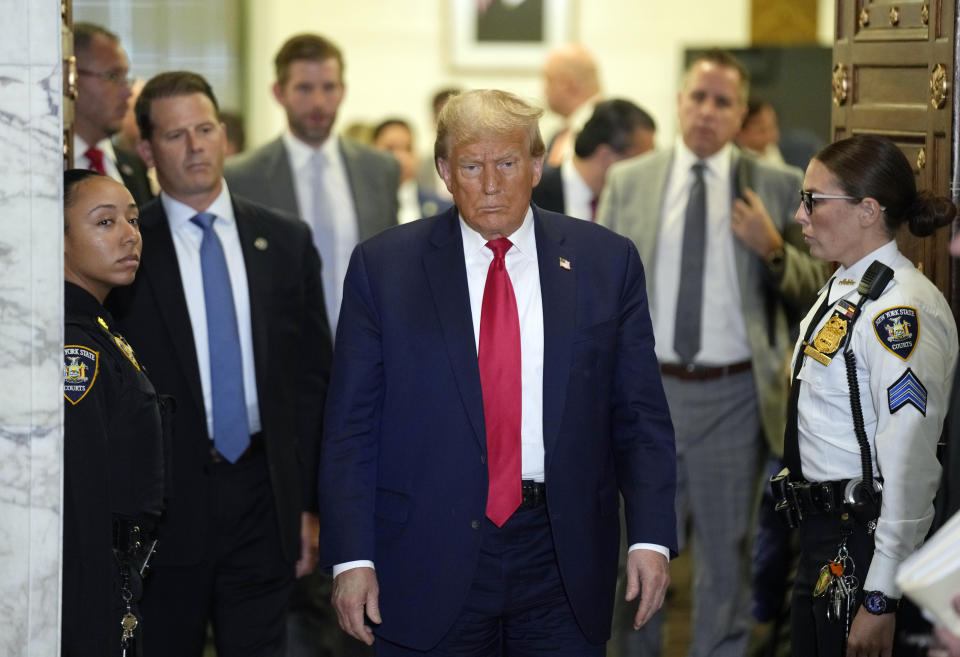 Former President Donald Trump leaves the courtroom at lunch break in his civil business fraud trial at New York Supreme Court, Tuesday, Oct. 17, 2023, in New York. (AP Photo/Seth Wenig)