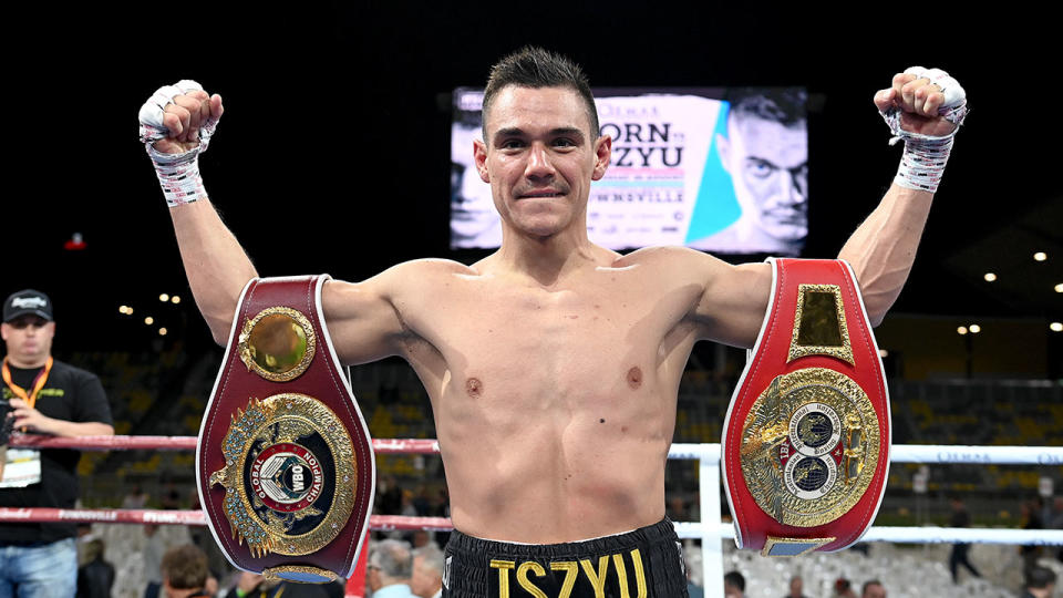 Pictured here, Tim Tszyu poses with his belts after beating Jeff Horn.