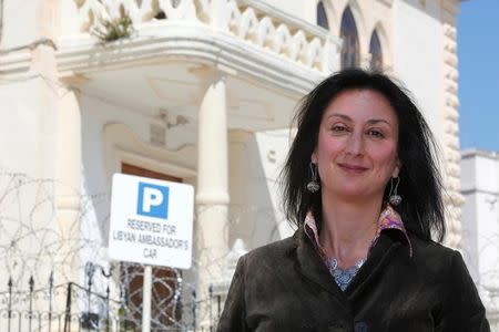Maltese investigative journalist Daphne Caruana Galizia poses outside the Libyan Embassy in Valletta April 6, 2011. REUTERS/Darrin Zammit Lupi/Files
