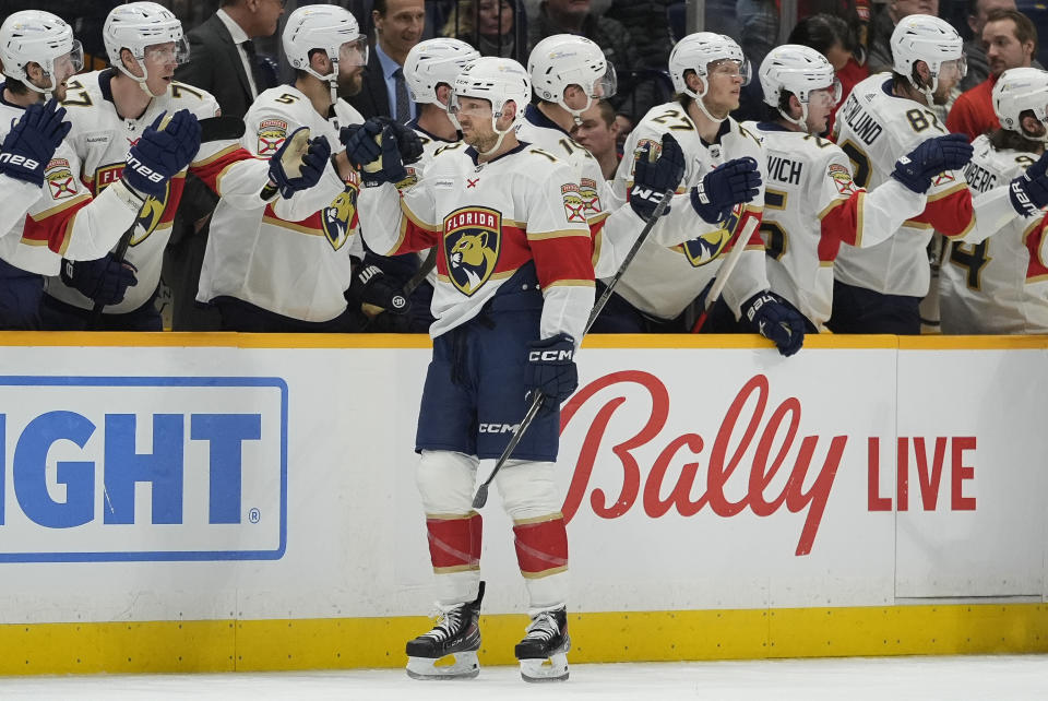 Florida Panthers center Sam Reinhart (13) celebrates a goal with teammates during the second period of an NHL hockey game against the Nashville Predators, Monday, Jan. 22, 2024, in Nashville, Tenn. (AP Photo/George Walker IV)