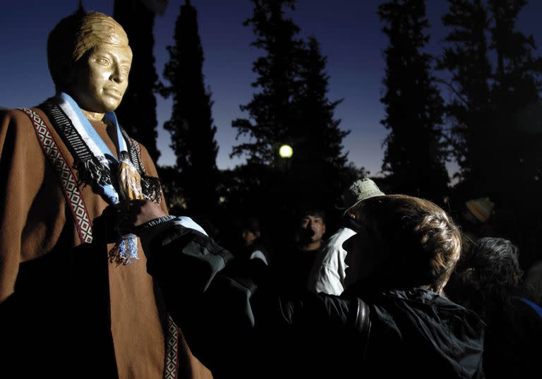 A faithful touches an Argentine Indian Ceferino Namuncura's statue at his sanctuary in Chimpay, southern Argentina, Saturday, Nov. 10, 2007. The first Argentine Indian to be beatified by the Roman Catholic church will be recognized by a papal envoy at a ceremony Sunday attended by thousands of faithful. Namuncura, the son of a Mapuche Indian chief who lived from 1886 until 1905, has a wide following among the Argentina's poor. Pope Benedict XVI signed a decree in July beatifying Namuncura. (AP Photo/Natacha Pisarenko)