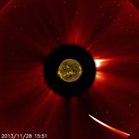 Comet ISON moves quite close to the sun in this image from ESA/NASA's Solar and Heliospheric Observatory captured at 10:51 a.m. EST on November 28, 2013, courtesy of NASA. REUTERS/ESA&NASA/SOHO/SDO/Handout via Reuters