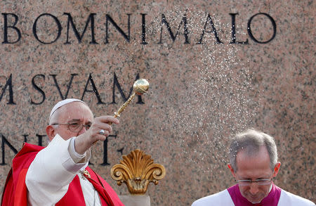 Pope Francis blesses faithful gathered to attend the Palm Sunday Mass in Saint Peter's Square, at the Vatican, April 14, 2019. REUTERS/Remo Casilli