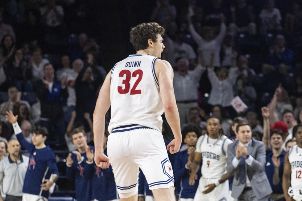 Richmond center Neal Quinn (32) celebrates his score during the first half of an NCAA college basketball game against Dayton on Saturday, Jan. 27, 2024 in Richmond, Va. (AP Photo/Shaban Athuman)