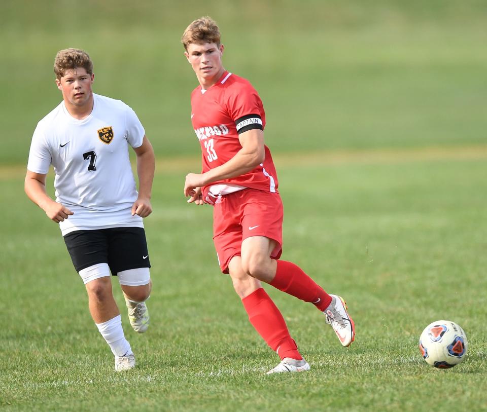 Rockwood's Jack Pletcher plays a ball in front of Northern Cambria defender during a non-conference soccer match, Sept. 20, in Rockwood.