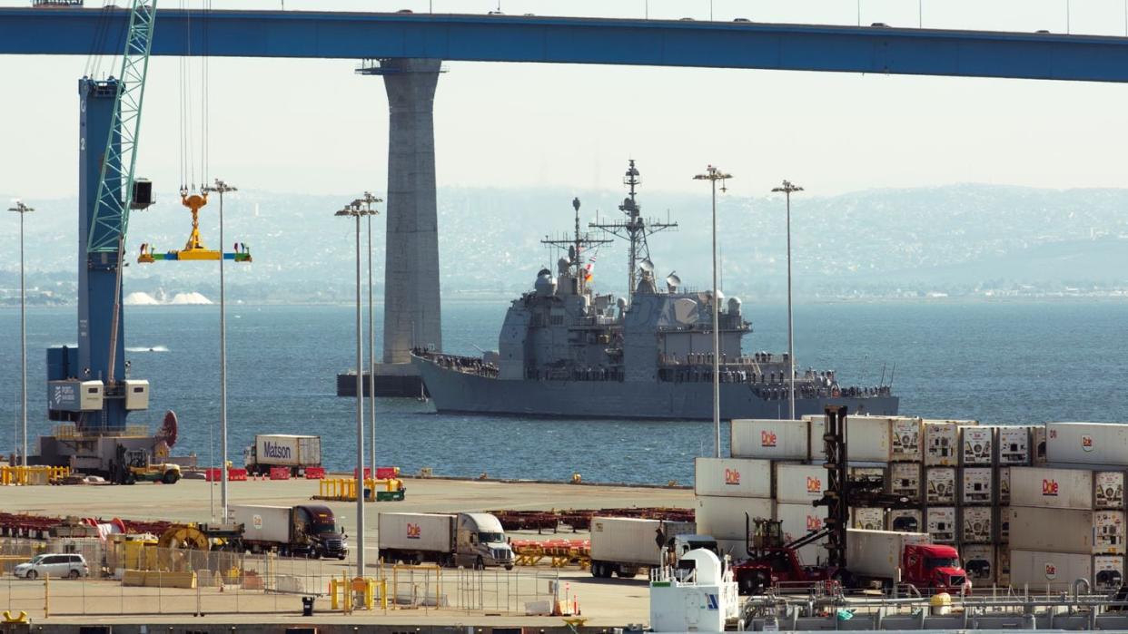 The USS Chosin slips through the San Diego Bay, near the bridge to Coronado, on Feb. 15, 2024, following a modernization period. (Colin Demarest/C4ISRNET)