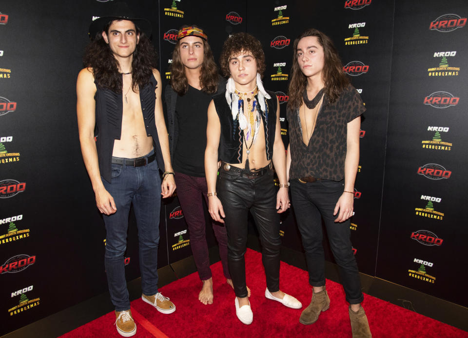 FILE - In this Dec. 8, 2018 file photo, Danny Wagner, from left, Sam Kiszka, Josh Kiszka, and Jake Kiszka of Greta Van Fleet pose at the 2018 KROQ Absolut Almost Acoustic Christmas in Inglewood, Calif. The young Michigan rockers whose sound and classic rock look is reminiscent of Led Zeppelin are nominated for four Grammy Awards. (Photo by Amy Harris/Invision/AP, File)