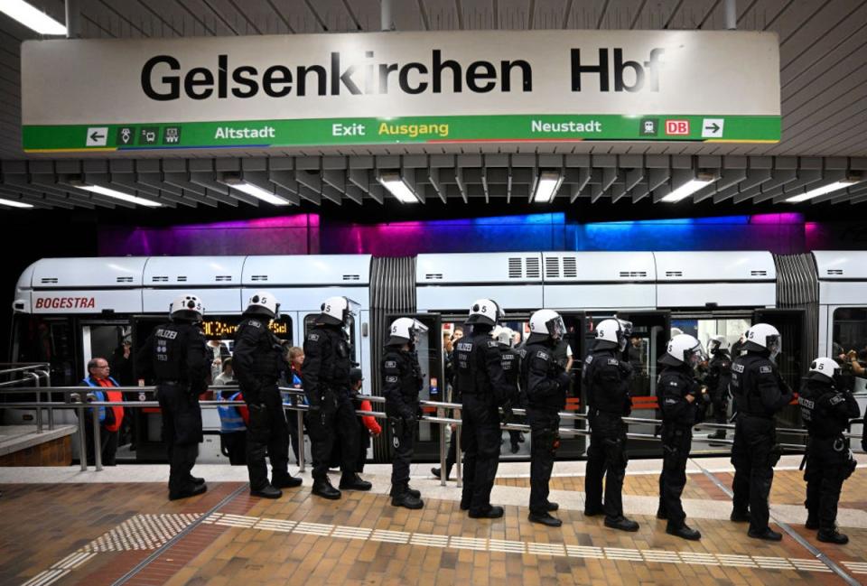 Riot police stands in Hauptbahnhof main railway station prior to the Group C England v Serbia match (Getty Images)